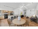 Open concept living space features kitchen, dining area, and comfortable sitting area, great for modern living at 800 Peachtree Ne St # 8509, Atlanta, GA 30308