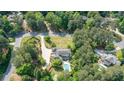 Expansive estate featuring a swimming pool, long private driveway, and lush green surroundings at 1550 Masters Club Dr, Sandy Springs, GA 30350