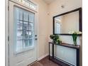 Inviting entryway with natural light, decorative mirror, stylish console table and decor at 1963 Lakeshore Overlook Nw Cir, Kennesaw, GA 30152