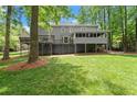 Expansive backyard view featuring a large back deck and forest surround at 2871 Liberty Ct, Marietta, GA 30066