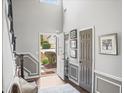Bright and airy foyer featuring high ceilings, hardwood floors, and a view of the front yard at 510 Rosedown Way, Alpharetta, GA 30022