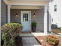 Inviting entrance with a light blue front door, white pillars, and beautifully landscaped surroundings at 510 Rosedown Way, Alpharetta, GA 30022