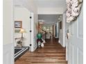 Warm and inviting foyer with hardwood floors and elegant decor at 912 Santa Anita Dr, Woodstock, GA 30189