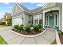 Inviting front porch with a beautifully landscaped walkway and charming outdoor decor at 912 Santa Anita Dr, Woodstock, GA 30189