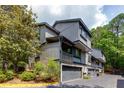A spacious townhome with drive-under garages and multiple balconies overlooking a wooded area at 3102 Balearic Se Dr, Marietta, GA 30067