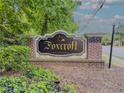 Attractive Foxcroft Condominium signage with brick surround and lush landscaping at 6851 Roswell Rd # 0-26, Atlanta, GA 30328