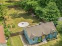 Aerial view of charming bungalow with a spacious backyard including a fire pit and garden at 1798 S Gordon Sw St, Atlanta, GA 30310