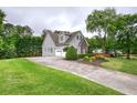 Home with a two-car garage and long driveway at 18 Spring Lake Ne Trl, White, GA 30184