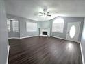 Inviting living room featuring a fireplace, vaulted ceilings and lots of natural light at 3647 Diamond Cir, Decatur, GA 30034