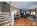 Open living space with hardwood floors and a staircase leading to upper level at 26 Kensington Rd, Avondale Estates, GA 30002