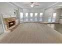 Spacious living room showcasing a fireplace and ample natural light at 4449 Sierra Creek Dr, Hoschton, GA 30548