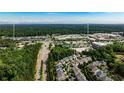 Aerial view of neighborhood and home at 11760 Stratham Dr, near Alpha Loop and Avalon at 11760 Stratham Dr, Alpharetta, GA 30009
