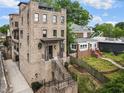 Beautiful exterior view of a multi-story brick house with meticulous landscaping and an inviting entrance at 629 Boulevard Ne, Atlanta, GA 30308