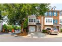 Charming brick townhome with a two car garage, complemented by a well-maintained lawn and mature trees at 632 Plaza Se Dr # 6, Kennesaw, GA 30144