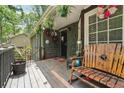 Inviting covered porch with comfortable seating, perfect for relaxing and enjoying the outdoors at 1490 Ashbrook Dr, Lawrenceville, GA 30043