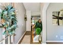 Inviting entryway featuring hardwood floors, fresh paint, and stylish decor at 301 Downing Creek Trl, Canton, GA 30114