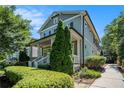Beautiful two-story home with a covered front porch and a neatly maintained landscaped yard with a sidewalk at 647 East Ne Ave, Atlanta, GA 30312
