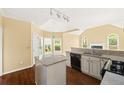 Open kitchen featuring granite countertops and stainless steel appliances at 3187 Gainer Dr, Powder Springs, GA 30127