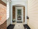 Charming front porch with stone accents and a cozy entrance at 220 Finchley Dr, Roswell, GA 30076