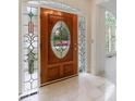 Elegant foyer featuring marble flooring and a decorative stained glass front door with sidelights at 1730 Point Pleasant Se, Smyrna, GA 30080