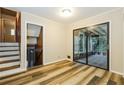 Bedroom with wood-look vinyl flooring and sliding glass doors to a screened-in porch at 2757 Shelley Ln, Ellenwood, GA 30294