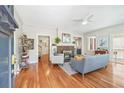 Cozy living room featuring a brick fireplace, hardwood floors, and natural light at 1028 Amsterdam Ne Ave, Atlanta, GA 30306