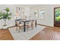 Bright dining room with hardwood floors, large windows, and modern decor at 301 Fortune Ne St, Atlanta, GA 30312