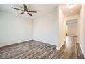 Neutral bedroom featuring stylish wood-look floors and a modern ceiling fan at 33 Oxford Ln, Kingston, GA 30145