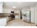 Well-lit kitchen featuring granite countertops and stainless steel appliances at 3335 New Heritage Dr, Alpharetta, GA 30022