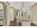 Bright kitchen with stainless steel appliances, granite countertops, and hardwood floors at 1559 Norwood Dr, Lilburn, GA 30047