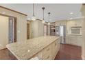 Bright kitchen with stainless steel appliances, granite countertops, and custom cabinetry at 1559 Norwood Dr, Lilburn, GA 30047