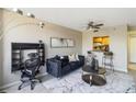 Comfortable living space with black sofa, workspace, and bar seating area at 1280 W Peachtree Nw St # 810, Atlanta, GA 30309