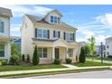 Charming two-story home with neutral siding, dark shutters, manicured lawn and welcoming front porch at 1436 Belmont Ave, Smyrna, GA 30080