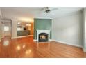 Bright living room featuring a fireplace, ceiling fan, and hardwood floors at 3094 Lauren Parc Rd, Decatur, GA 30032