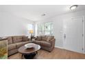 Comfortable living room with a large window, providing ample natural light and an inviting atmosphere at 6606 Coventry Pt, Austell, GA 30168