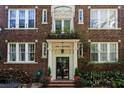 Charming brick apartment building with manicured landscaping and decorative details at 301 10Th Ne St # 12, Atlanta, GA 30309