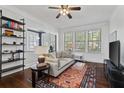 Cozy living room with hardwood floors, ceiling fan, and comfortable seating area at 301 10Th Ne St # 12, Atlanta, GA 30309