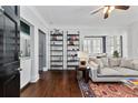 Spacious living room features hardwood floors, built-in shelving, and natural light at 301 10Th Ne St # 12, Atlanta, GA 30309