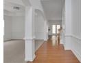 Bright foyer with hardwood floors, white trim, and an open floor plan at 3208 Juniper Nw Dr, Kennesaw, GA 30144