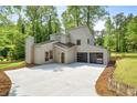 Modern home with unique architectural design, pristine landscaping, and attached two-car garage at 2934 Wendover St, Marietta, GA 30062