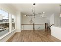 The dining area features wood floors, natural light, and a modern chandelier at 4382 Benfield Se Way, Smyrna, GA 30080