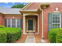 Inviting front entrance with green shutters and well-maintained landscaping at 1815 Montcliff Dr, Cumming, GA 30041