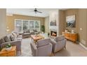 Cozy living room featuring ample seating, a fireplace, and large windows at 1815 Montcliff Dr, Cumming, GA 30041
