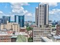 Scenic aerial view of the Atlanta skyline with The Legacy building prominent against the clear blue sky at 57 Forsyth Nw St # 12B, Atlanta, GA 30303