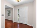 Clean entrance featuring hardwood floors, neutral paint, and ample natural light at 440 Ohern Ct, Stone Mountain, GA 30088