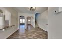 Inviting entryway with hardwood floors, staircase, and arched doorways at 2548 Bellview Nw Ave, Atlanta, GA 30318