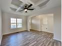 Bright living room featuring hardwood floors, coffered ceilings and modern ceiling fan at 2548 Bellview Nw Ave, Atlanta, GA 30318