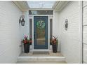 Inviting entryway with stylish front door and decorative planters at 9889 Between The Grns, Villa Rica, GA 30180