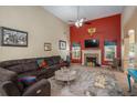 Cozy living room features a fireplace, high ceilings, and lots of natural light at 25 Skylar Dr, Covington, GA 30016