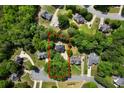 A neighborhood aerial view showcases the property's private, wooded lot in a tranquil suburban setting at 2701 Gentry Dr, Douglasville, GA 30135